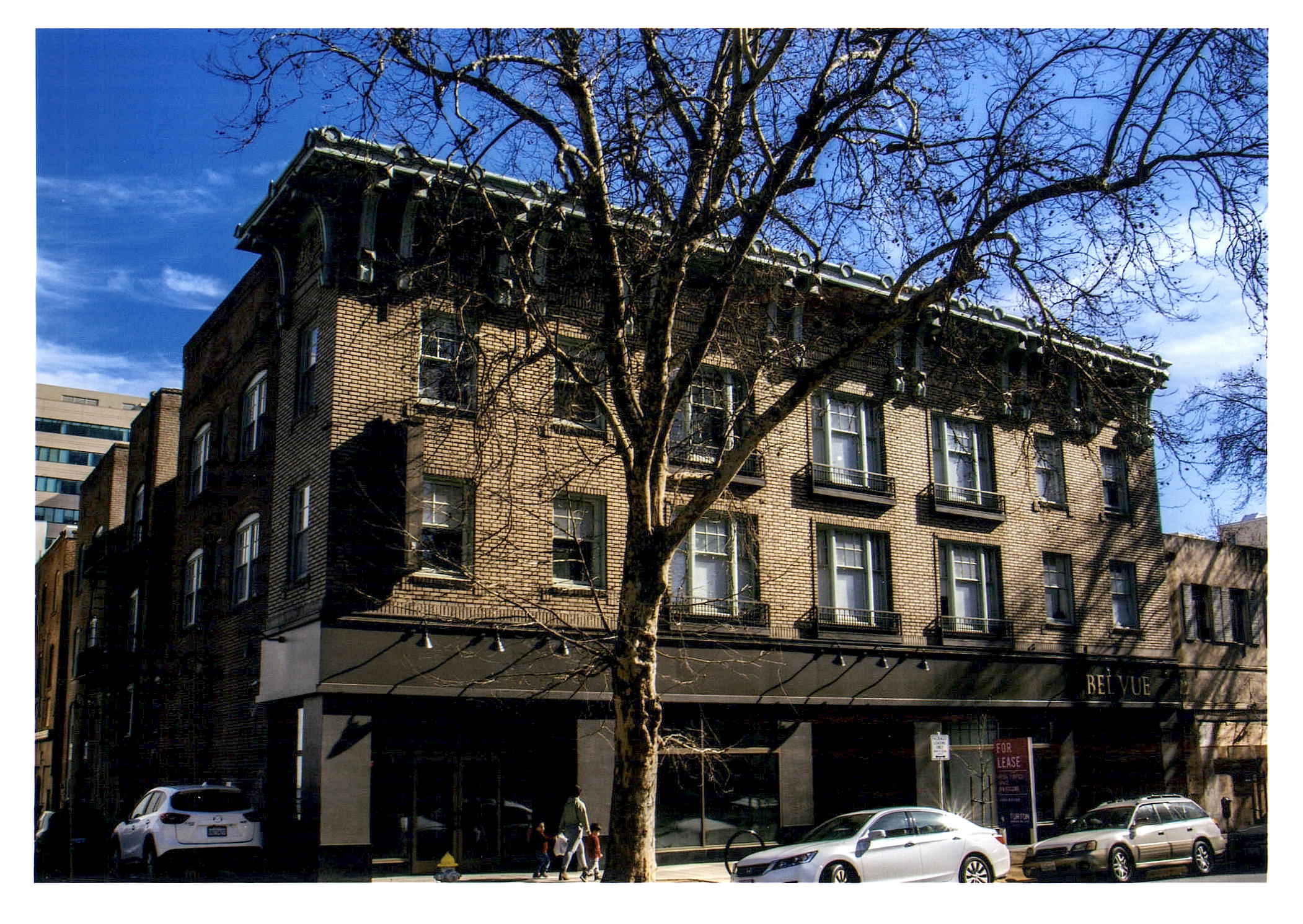 After: view of front facade of Bel Vue apartments from across the street.